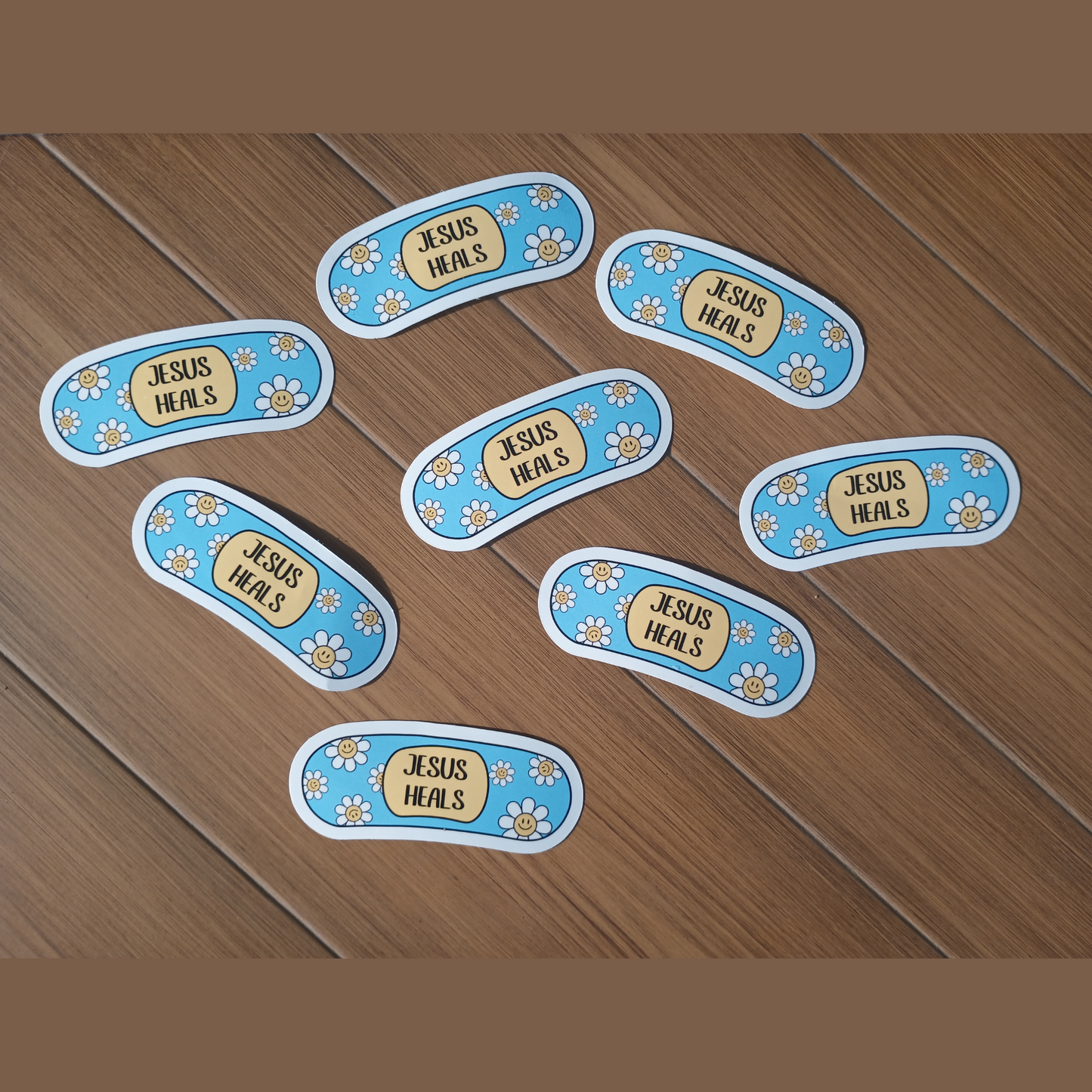 Blue Jesus Heals Sticker – Faith Bandage with Daisies, 3" Waterproof Vinyl