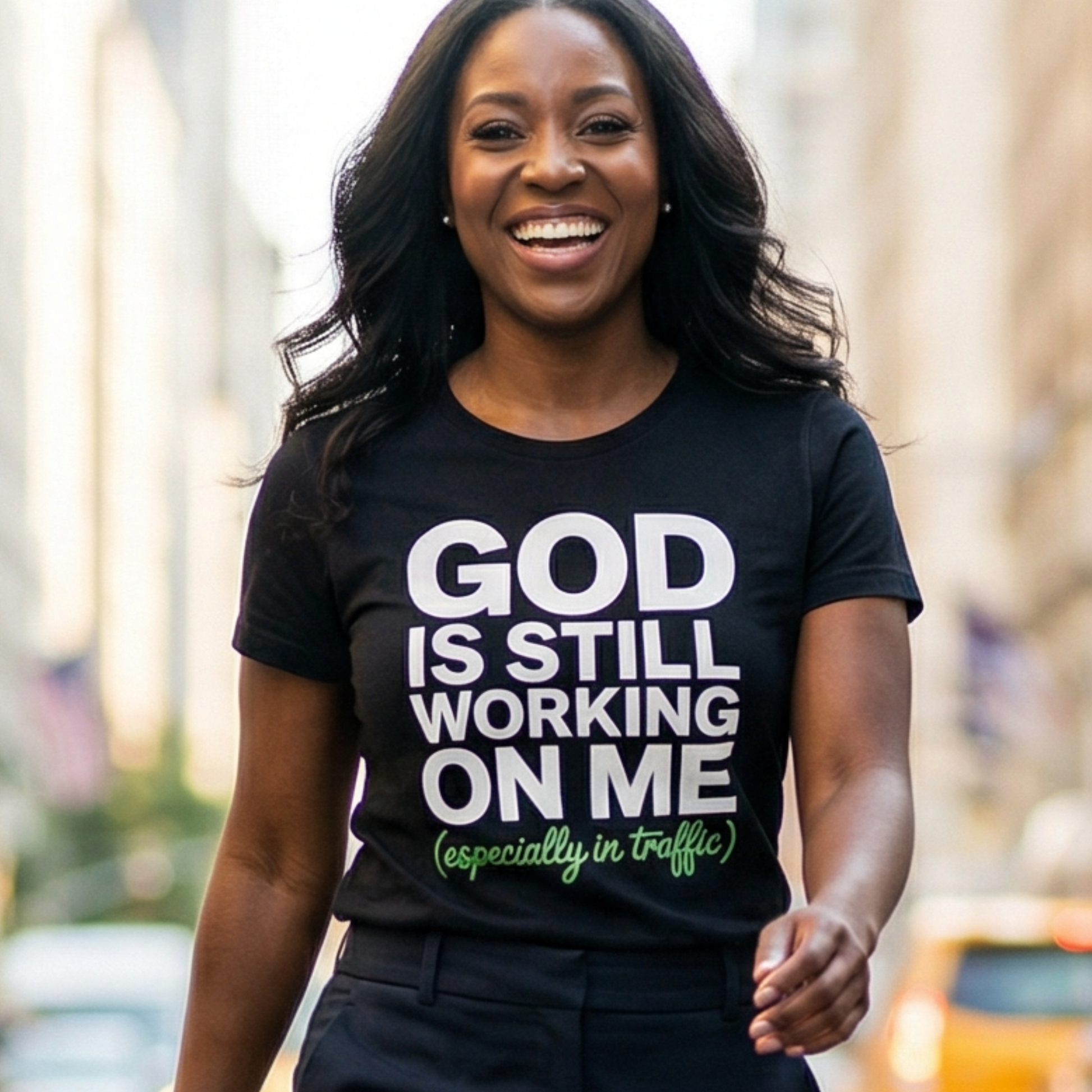 Woman wearing a black t-shirt with a humorous message in an urban setting