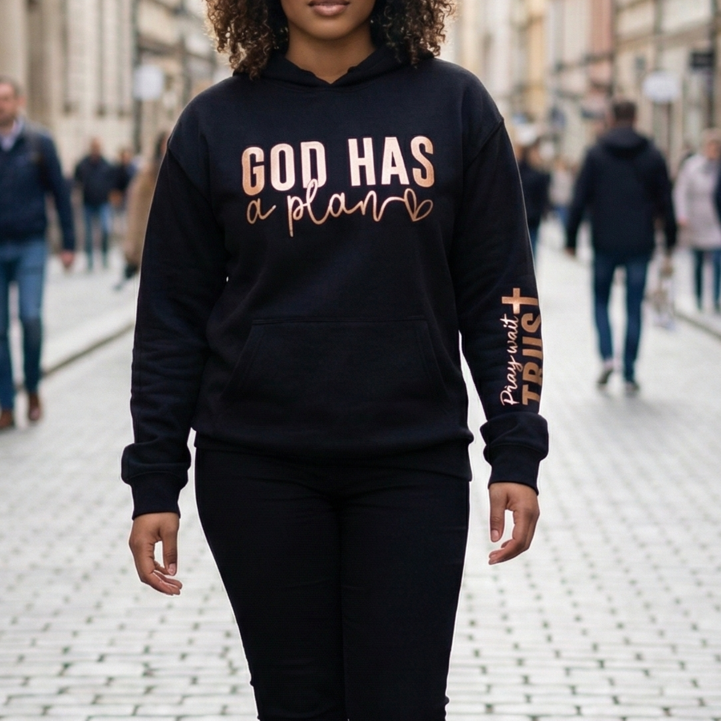 God Has a Plan Hoodie – Black Christian Hoodie with Rose Gold Foil & Pray Wait Trust Sleeve | Faith Apparel for Women